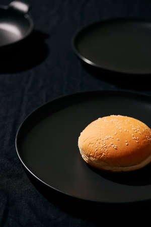 Process making of burger, step by step isolated on black background. Burger wide banner. Split burger. Burger divided in partsの写真素材
