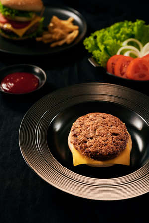 Fresh Tasty burger on dish with with french fries, ketchupの写真素材