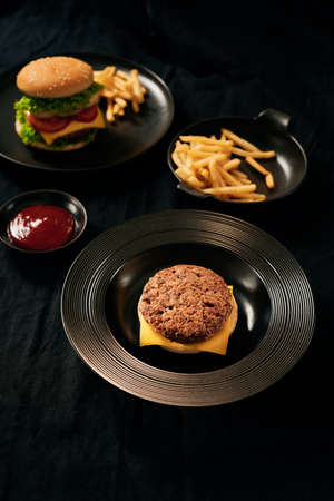 Fresh Tasty burger on dish with with french fries, ketchupの写真素材
