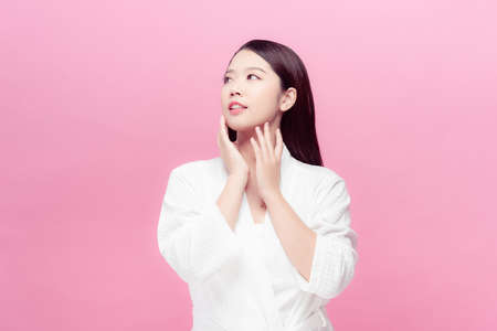 woman in a bathrobe on a white background, cleanliness, health, cosmetics,の写真素材