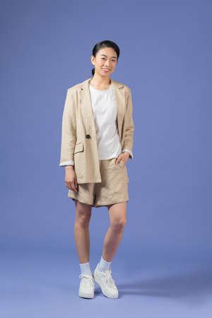 Photo of self-assured freelancer lady crossed arms wear khaki suit isolated purple color backgroundの写真素材