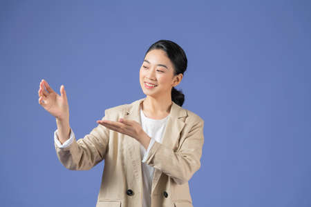 girl holds something invisibleの写真素材
