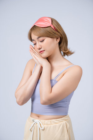 Sleepy beauty woman resting on hand.の写真素材