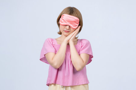 woman with eye mask sleepingの写真素材
