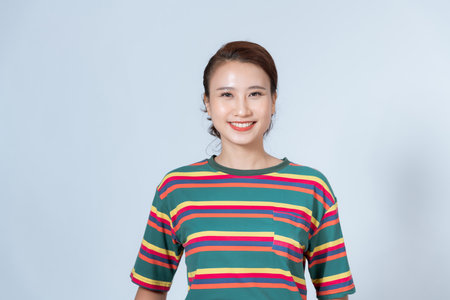 Close-up portrait of an attractive young woman smilingの写真素材