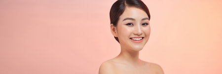 Beautiful Woman Face Portrait. Female Touching Skin Under Eyesの写真素材