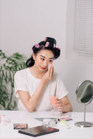 Young Beauty Asian Woman Cleaning Face with Cotton Clear Face Skincare and Smile Morningの写真素材