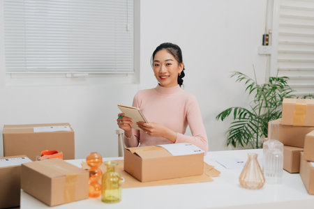 Young business woman working online shopping at her homeの写真素材