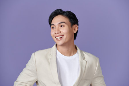 young handsome asian business man standingの写真素材