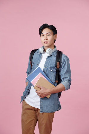 A photo of a handsome Asian student with a confident lookの写真素材