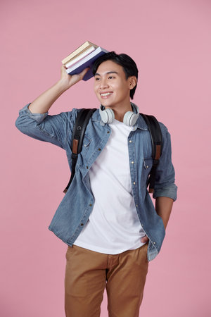 A photo of a handsome Asian student with a confident lookの写真素材