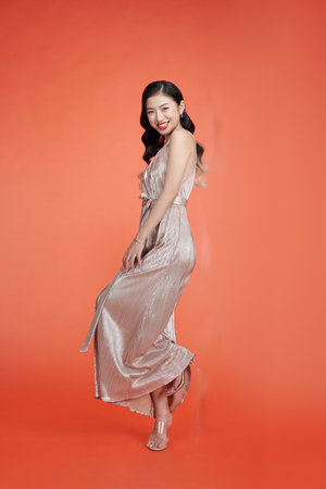 Fashion photo of young magnificent woman in sparkle dressの写真素材