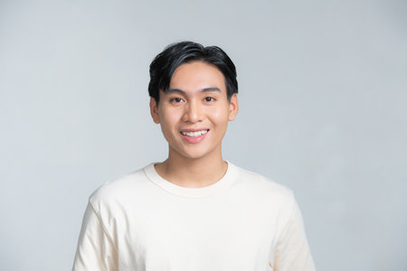 Attractive young handsome smiling face positive asianの写真素材
