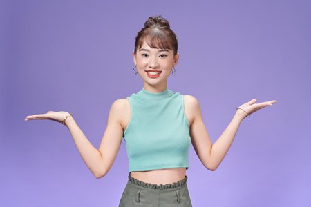 Photo of young cheerful girl hold hands solution promotion advertiseの写真素材