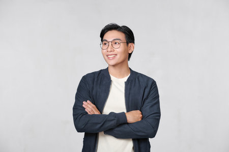normal young man standing on a white backgroundの写真素材