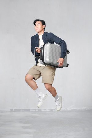 Excited guy going on vacation after lockdownの写真素材