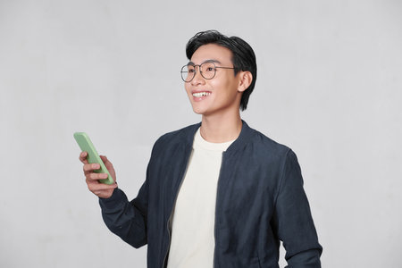 Man Standing Using Phone Isolatedの写真素材