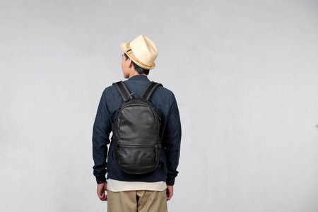 Asian man traveling backpacker on white backgroundの写真素材