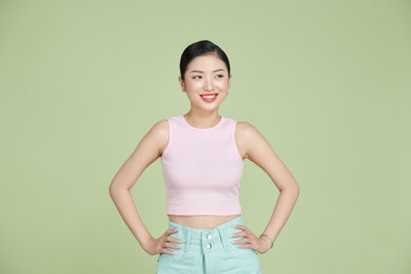 full body portrait of happy young beautiful woman isolated on a white backgroundの写真素材
