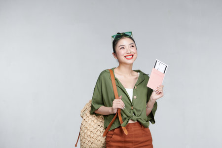 happy woman girl with suitcase and passport over gray backgroundの写真素材