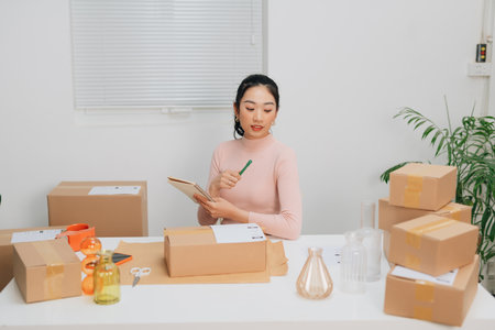 Young business woman working online shopping at her homeの写真素材