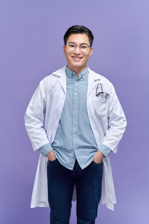 healthcare and medical concept - young male doctor with stethoscopeの写真素材