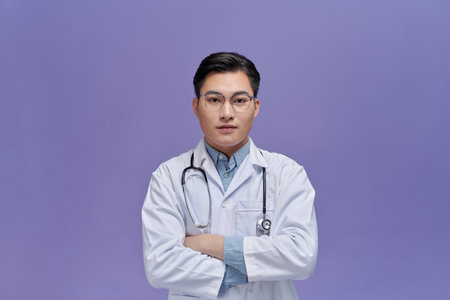 Portrait of male confident doctor over  purple, healthcare and Medical technology concept.の写真素材