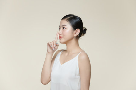 Beauty asian women touching nose skin care healthy and skin.の写真素材