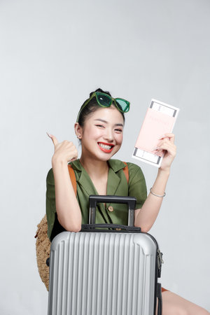 happy woman girl with suitcase and passportの写真素材