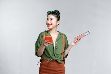 Tourist Asia girl having exciting travel promotion offer.の写真素材