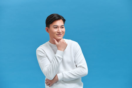 Smiling Young Attractive Man Touching Chinの写真素材