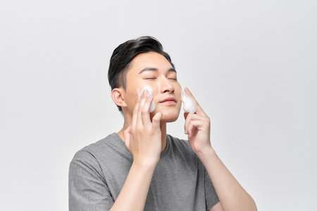 Young man washing his face Beauty Imageの写真素材