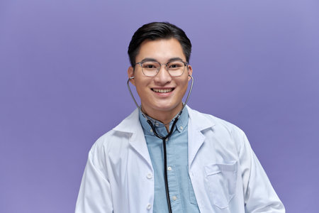 Young male doctor  with emotions of joy and a smile at the doctor looking at the camera.の写真素材