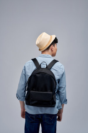 Asian man traveling backpacker on white background