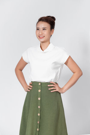 business woman with hands on hips isolated on a white backgroundの写真素材
