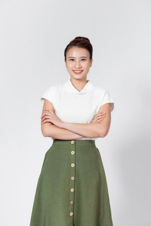 Portrait smiling young asian woman with crossed armsの写真素材