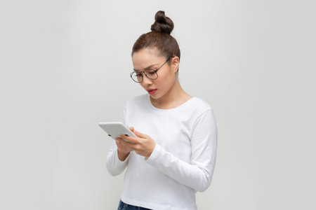 Woman accountant portrait. Young business woman. White background isolated.の写真素材