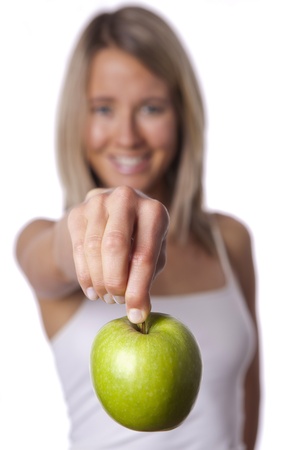 female holds appleの写真素材