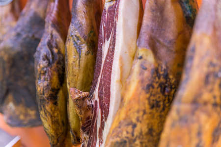 Many legs of iberian ham whit a cut