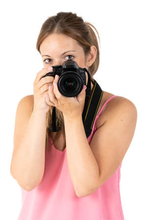 A woman with a black camera isolated on a white backgroundの写真素材