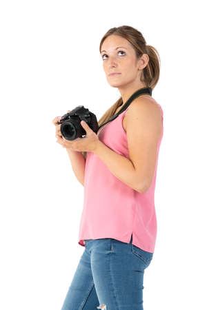 A woman with a black camera isolated on a white backgroundの写真素材