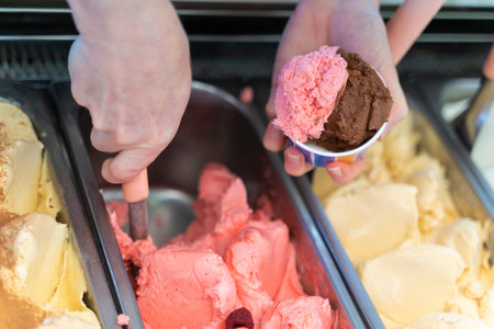 colse-up image of a hands preparing an ice creamの写真素材