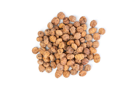 Top view of a bunch of tiger nuts on a white background.の写真素材