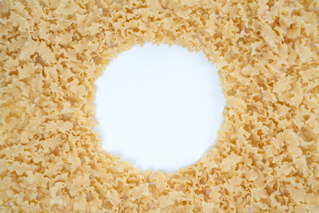 Background image with dry mini lasagna noodles with copy space on the centerの写真素材