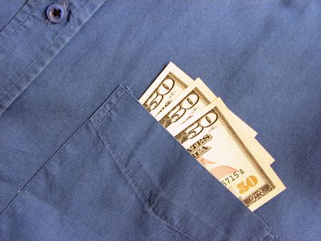 three dollar bills on the pocket of a shirtの写真素材