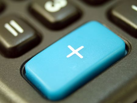 close up on the big plus key of a calculatorの写真素材