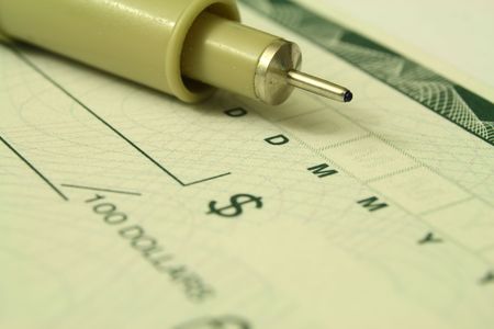 pen over a cheque の写真素材