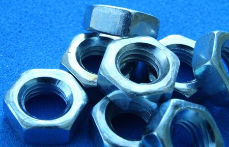 close up on bolts on under blue light