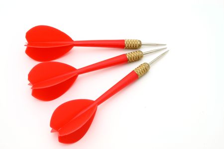 three red darts on a white surfaceの写真素材
