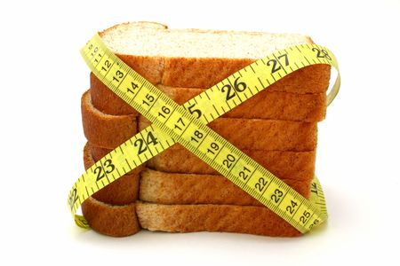 yellow tape measure wrapped around several slices of bread